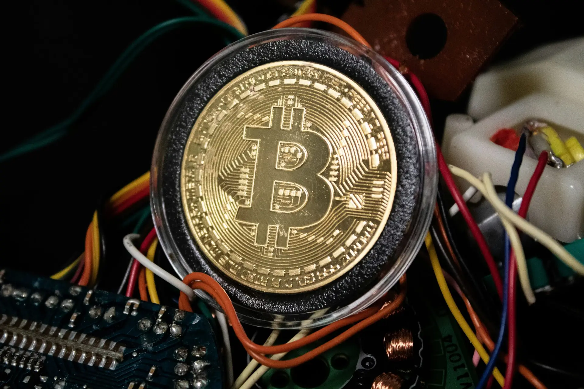 black and gold round crypto coin